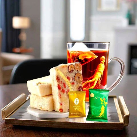 有机混合人参凉茶，用于增强免疫力和降血糖支持，装在礼品盒或杯子中